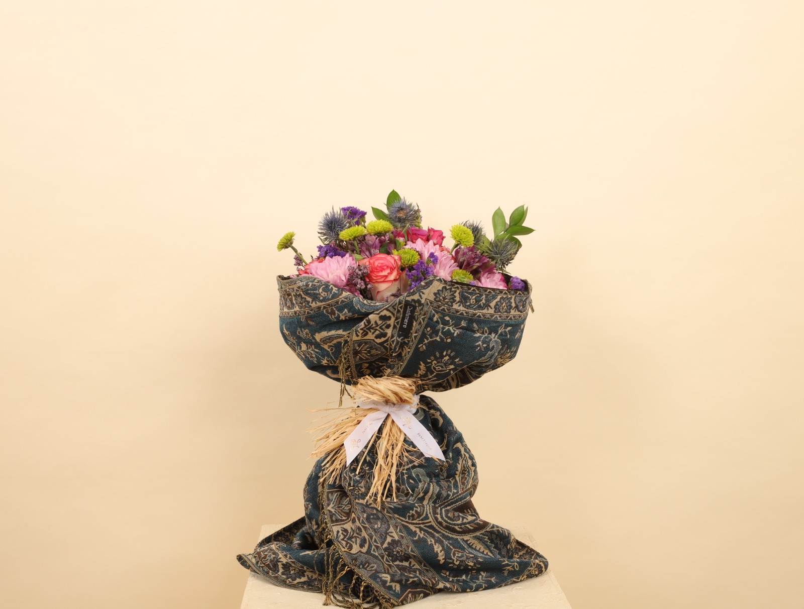 bouquet wrapped in a luxurious cashmere scarf